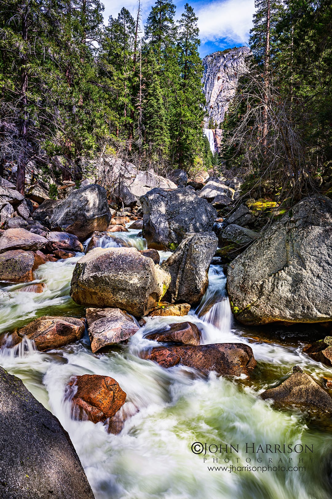 Vernal Fall in Yosemite National Park viewed from the bridge with spring runoff rushing through the Merced River