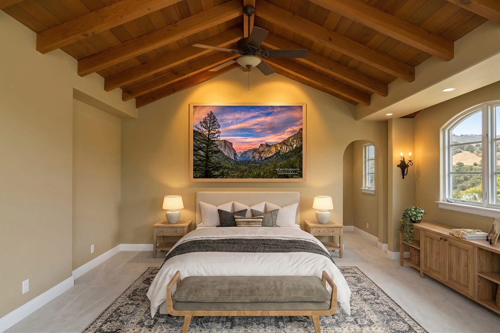 Yosemite Tunnel View sunset fine art landscape photograph displayed above a bed in a luxury bedroom interior inspired by Yosemite Valley.